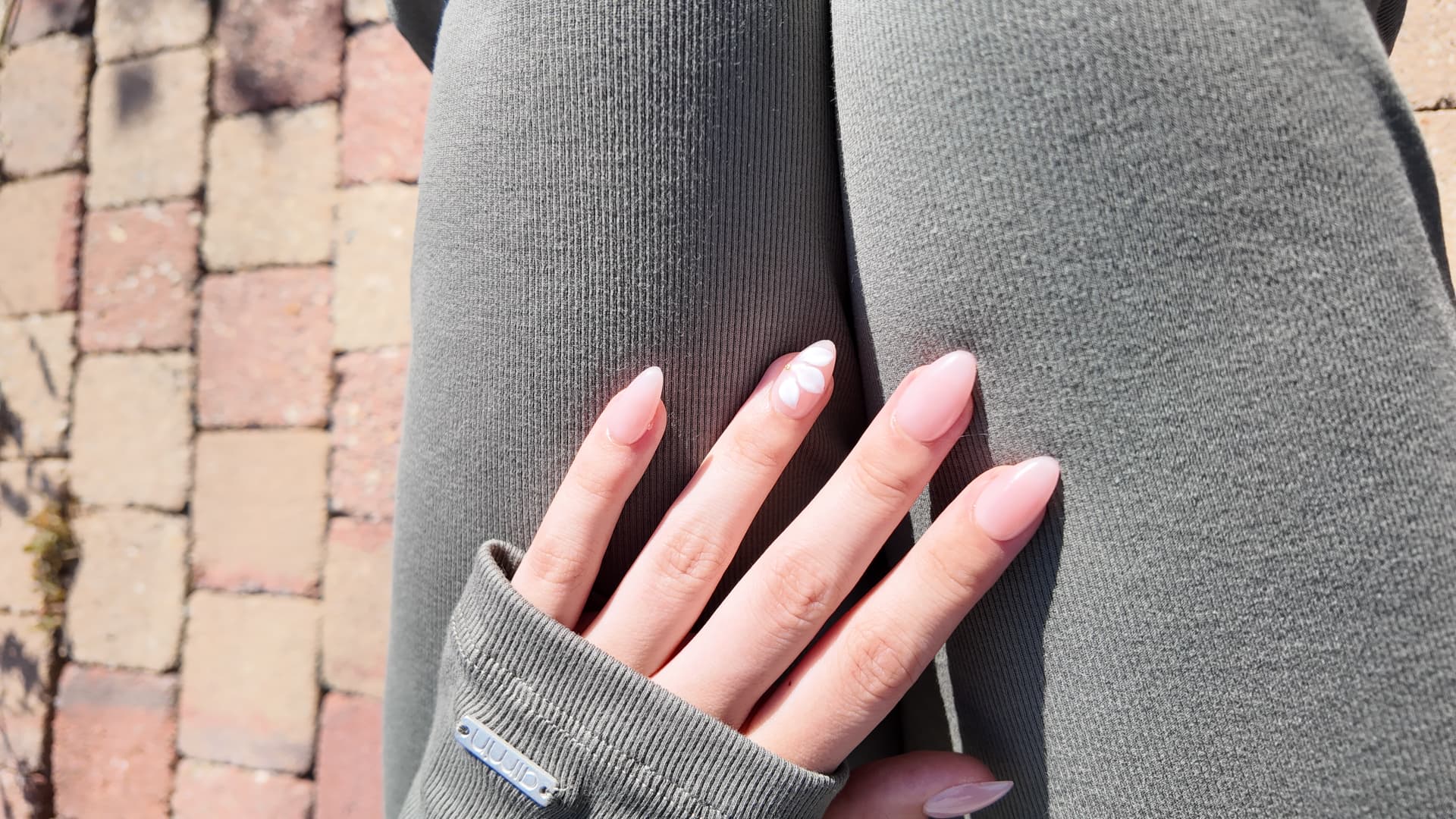 Nail set with floral detail in sunlight