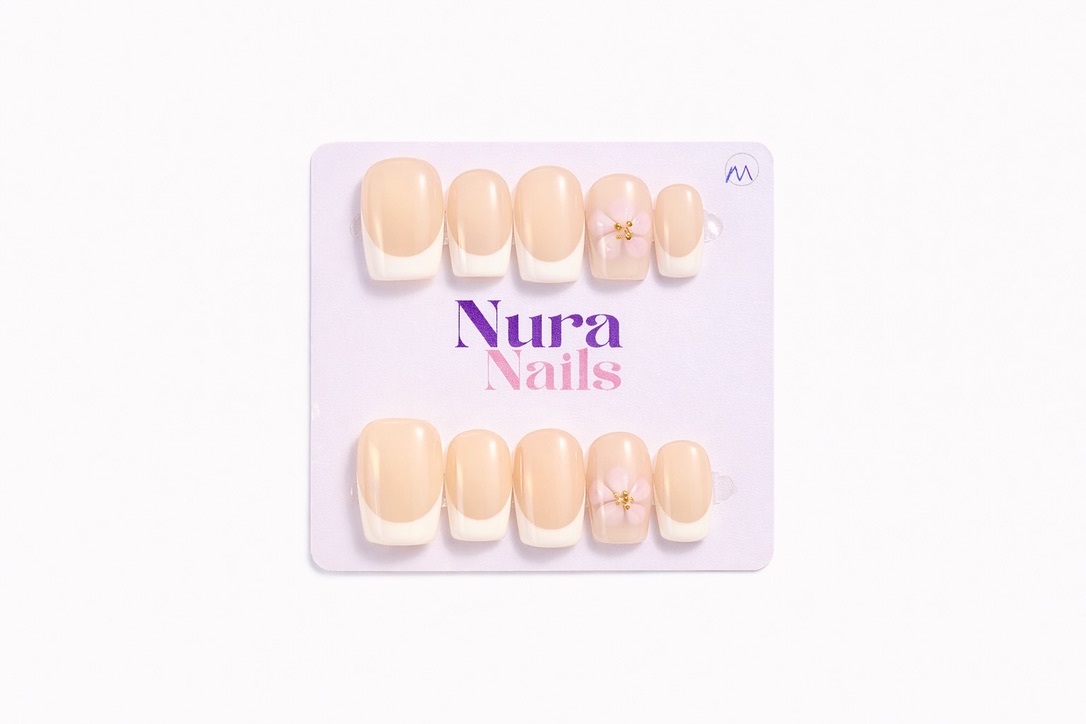 Custom nail design - nude french tips with pink flower accent
